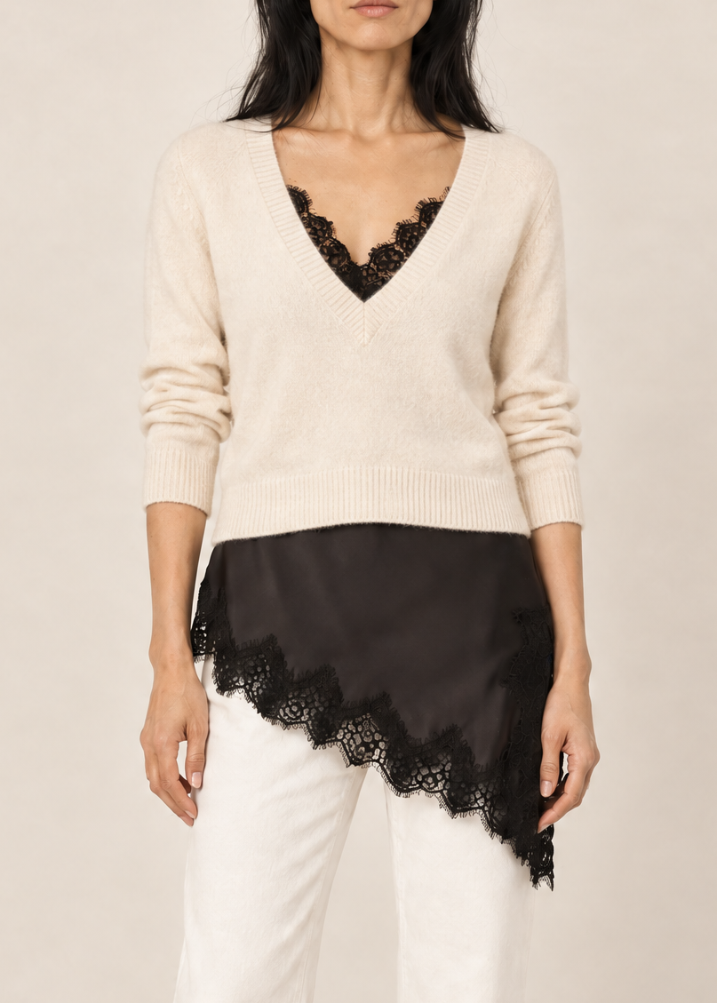 Generated_with_Kive.ai_-_Add_a_cream-colored_V-neck_sweater_layered_over_the_black_camisole._The_sweater_should_end_at_the_natural_waist__leaving_the_camisole_s_distinctive_black_lace.png
