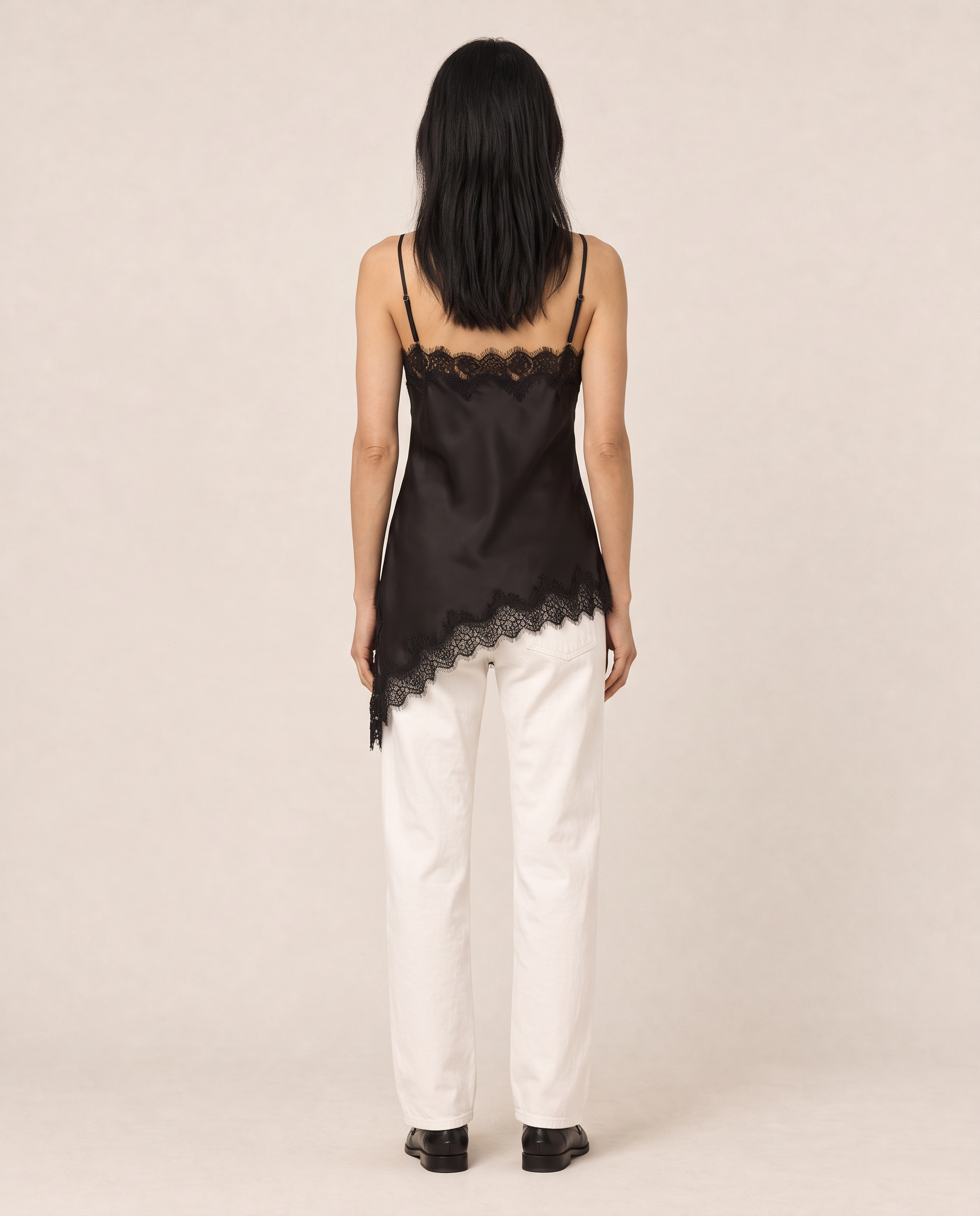 Generated_with_Kive.ai_-_Black_Asymmetrical_Lace_Trim_Cami_Mina_Create_a_matching_alternate_camera_view_of_the_same_full-body_fashion_photograph._Image_1_is_the_source_for_Mina_s_stan.png