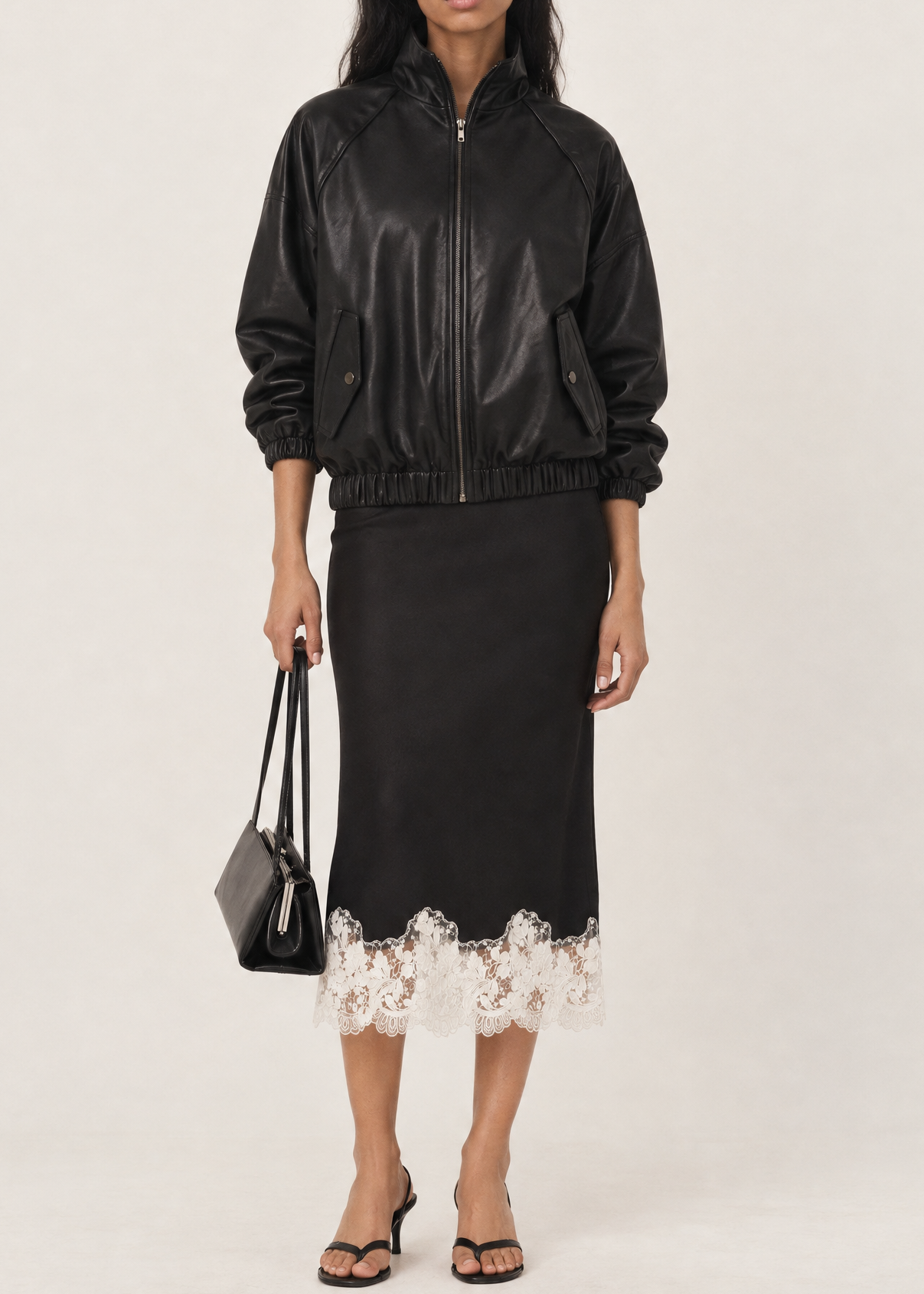 Generated_with_Kive.ai_-_Black_Shantel_Lace_Trim_Midi_Skirt_with_black_leather_bomber_jacket_and_styling_like_reference_photo_on_Iora_in_Muted_Gallery.png