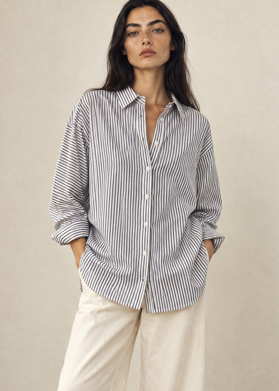 Generated_with_Kive.ai_-_Le_Bon_Shoppe_Blue_Striped_Light_Weight_Owen_Shirt_Neva_White_Studio_styled_with_cream_wide_leg_crop_pants_and_flats.png