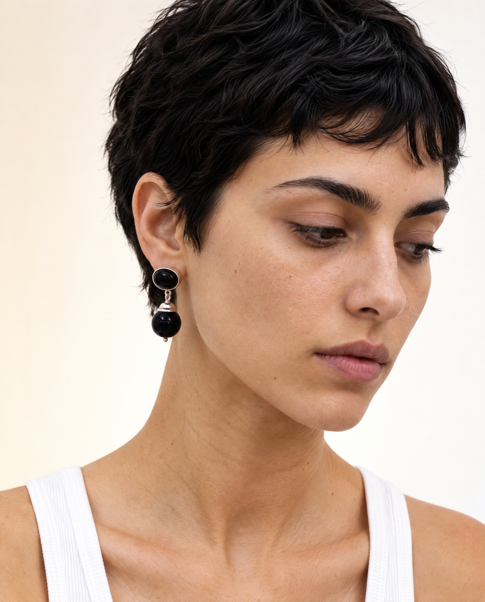 Generated_with_Kive.ai_-_Turn_the_woman_s_head_toward_the_right_side_of_the_image_and_angle_her_chin_slightly_down__with_her_eyes_looking_down_in_that_direction._Keep_the_same_close-u.png