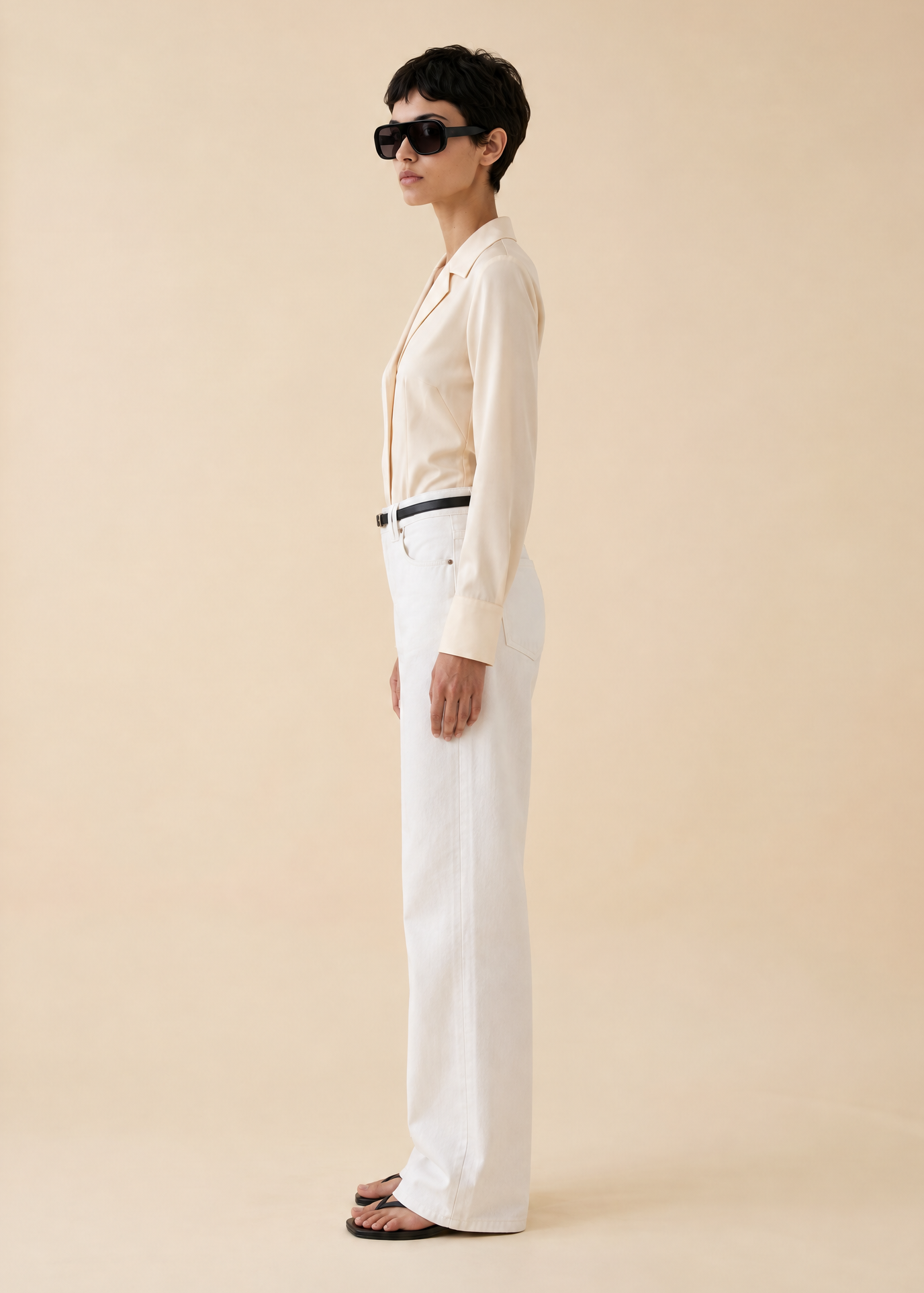 Generated_with_Kive.ai_-_Vintage_Donna_Karan_Cream_Silk_Bodysuit_Ines_Create_a_full-length_side-profile_fashion_image_of_Ines_wearing_the_exact_same_outfit_shown_in_Image_1_cream_silk.png